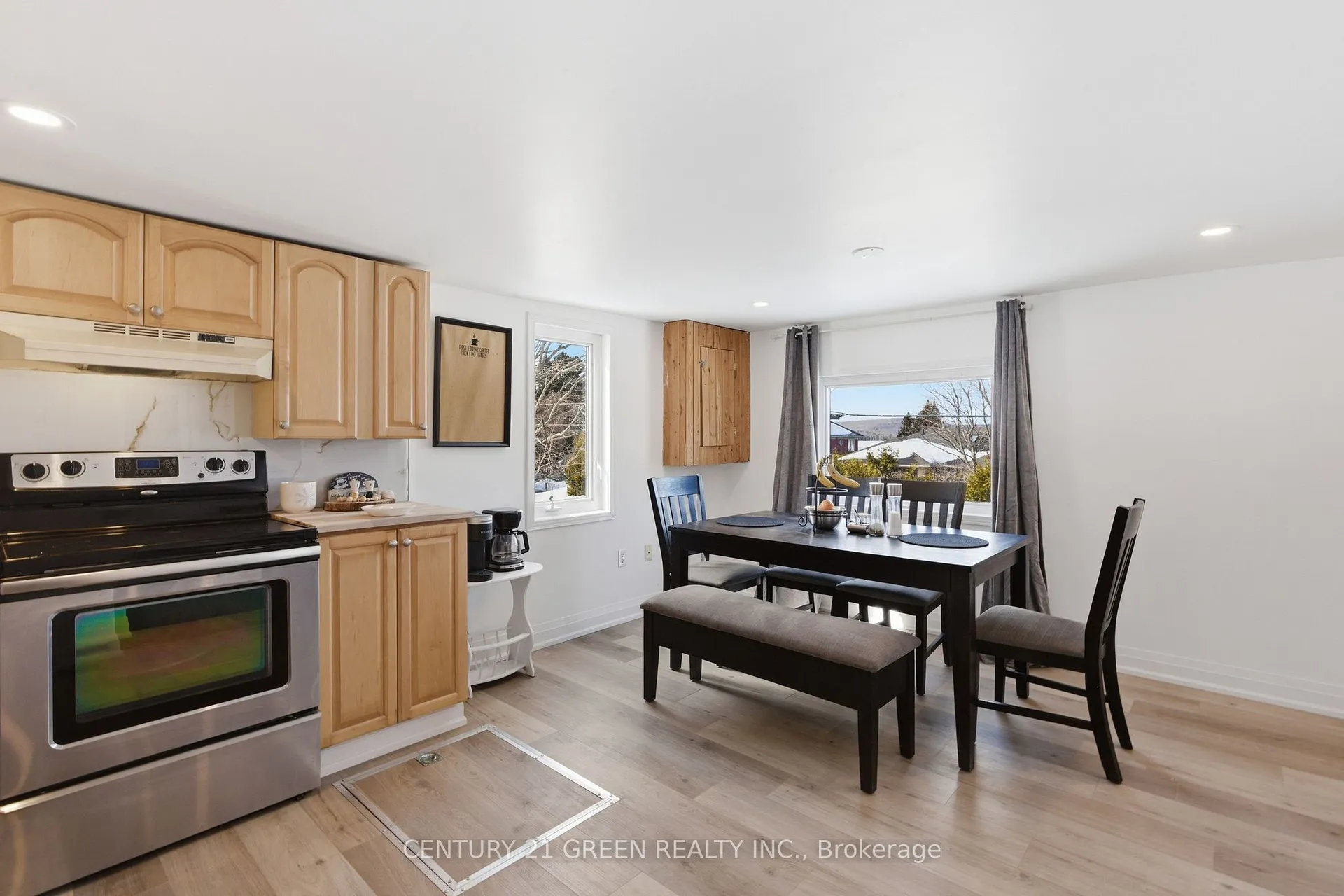 135 Village Street, Hastings Highlands — kitchen and dining area with wood cabinetry, table and lake view