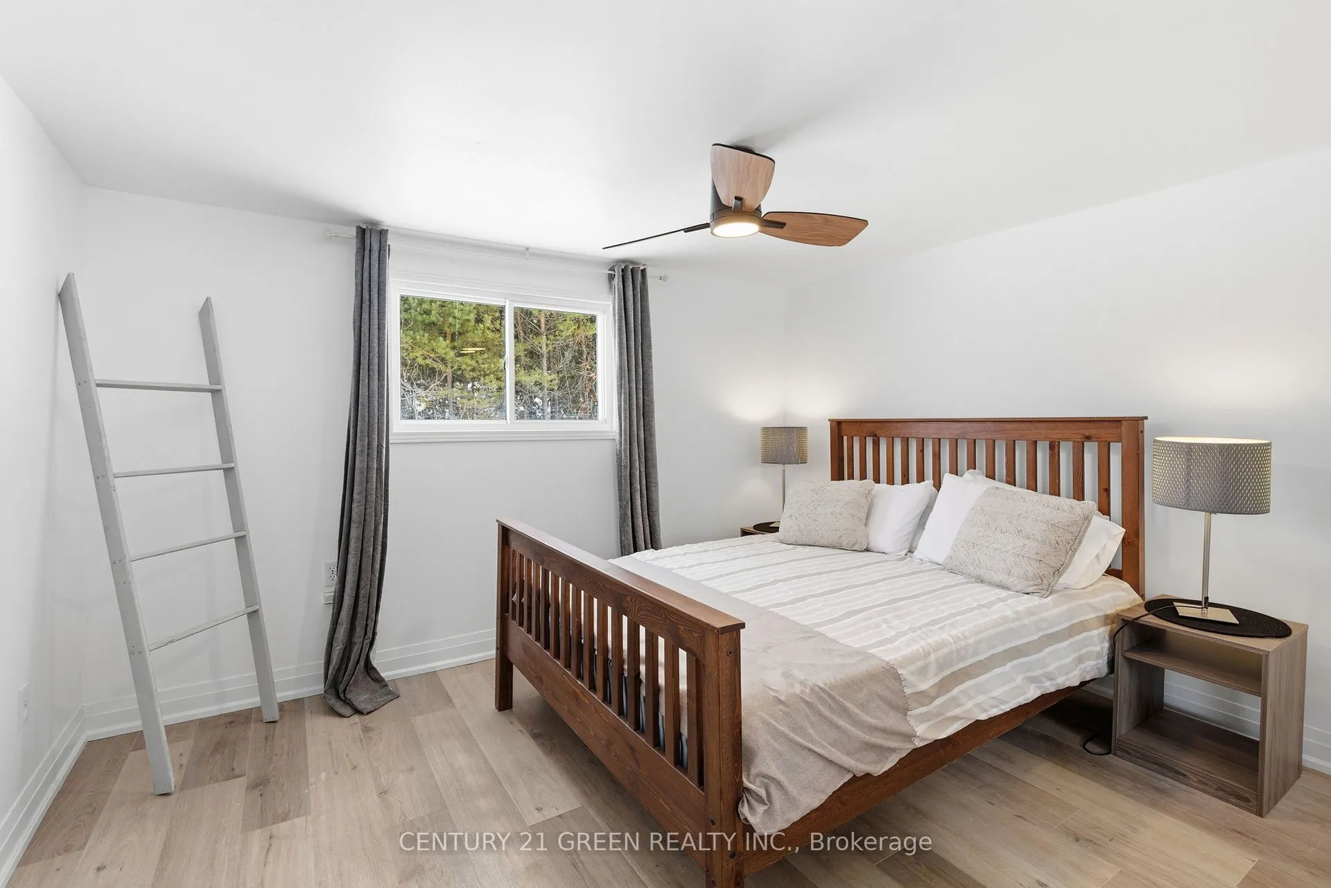 135 Village Street, Hastings Highlands — bedroom with queen bed, ceiling fan, curtains and wood-look flooring